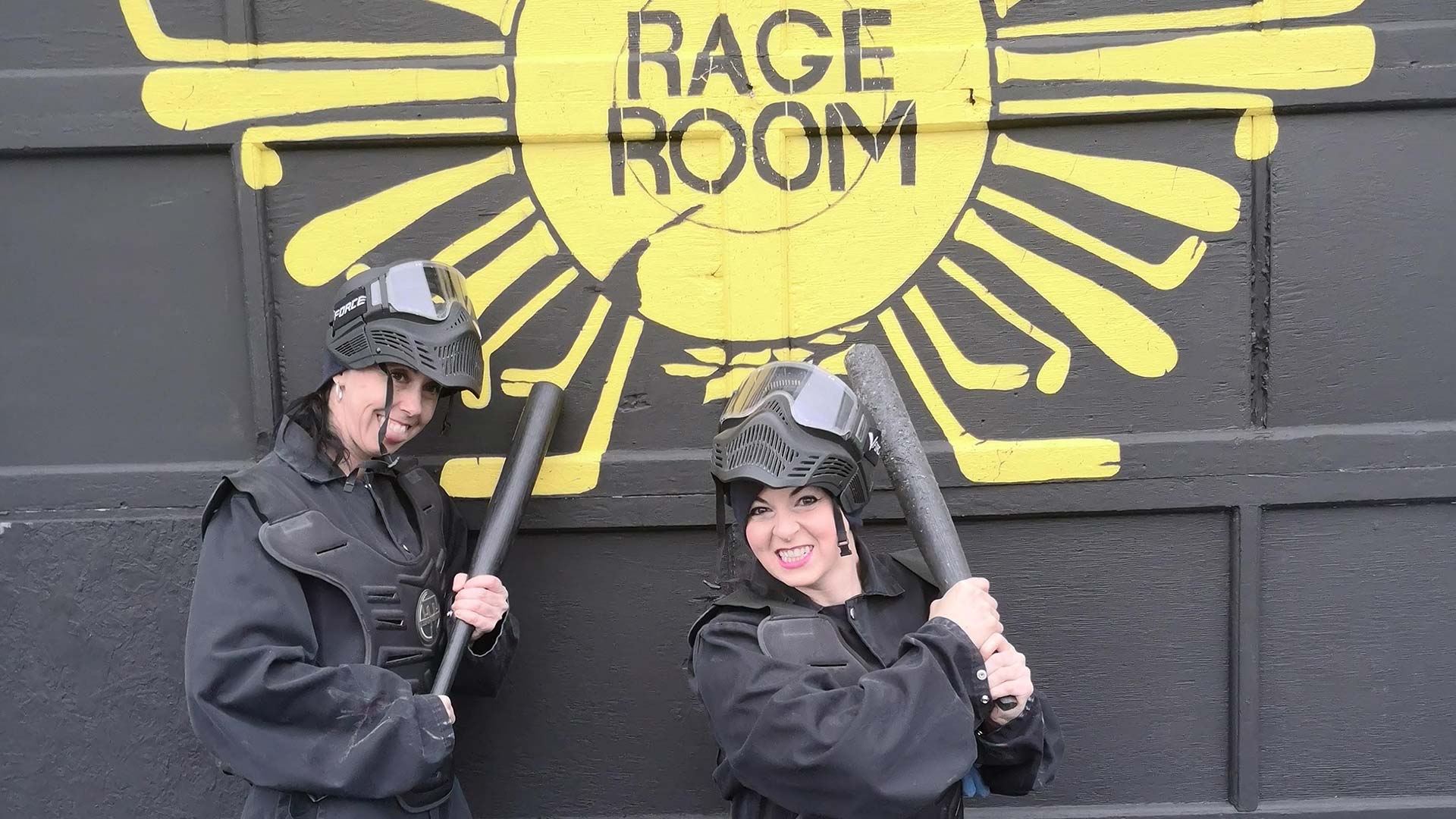 Two happy people standing together after a rage room session, showing satisfaction. Abandoned Cart Email Strategy