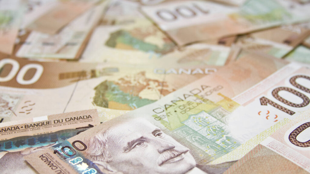 Photo of Canadian 100 dollar bills for a blog post about Nova Scotia small business grants